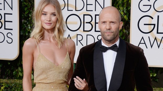 Rosie Huntington-Whiteley announced her engagement to Jason Statham when she flashed her engagement ring at the Golden Globes on Sunday.
