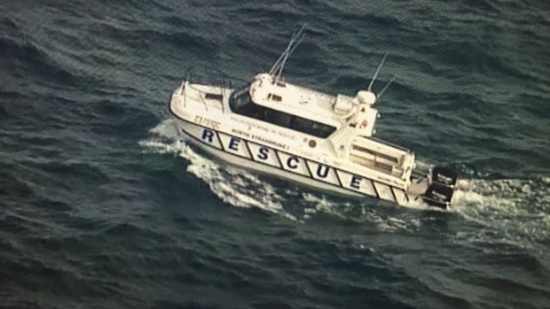 Water police respond to the incident at the entrance to Moreton Bay.