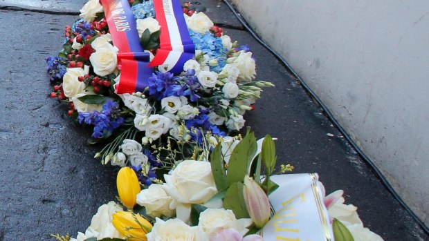 Bouquets of flower lay at the scene of the attacks to mark the anniversary. 