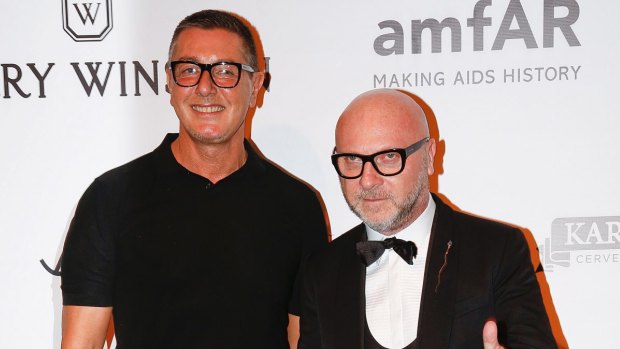 Italian fashion designers Domenico Dolce, right, and Stefano Gabbana pose on the red carpet of The Foundation for AIDS Research (amfAR) event in Sao Paulo, Brazil, Friday, April 15, 2016.