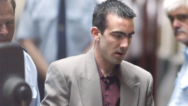 Jason Roberts is led into court in December 2002.