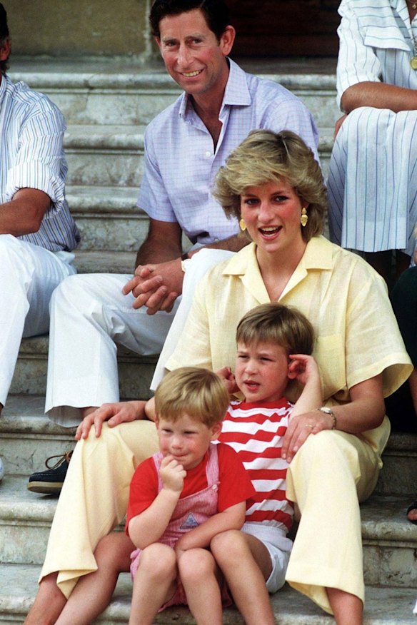 The Prince and Princess of Wales on holiday with their children, Princes William and Harry.