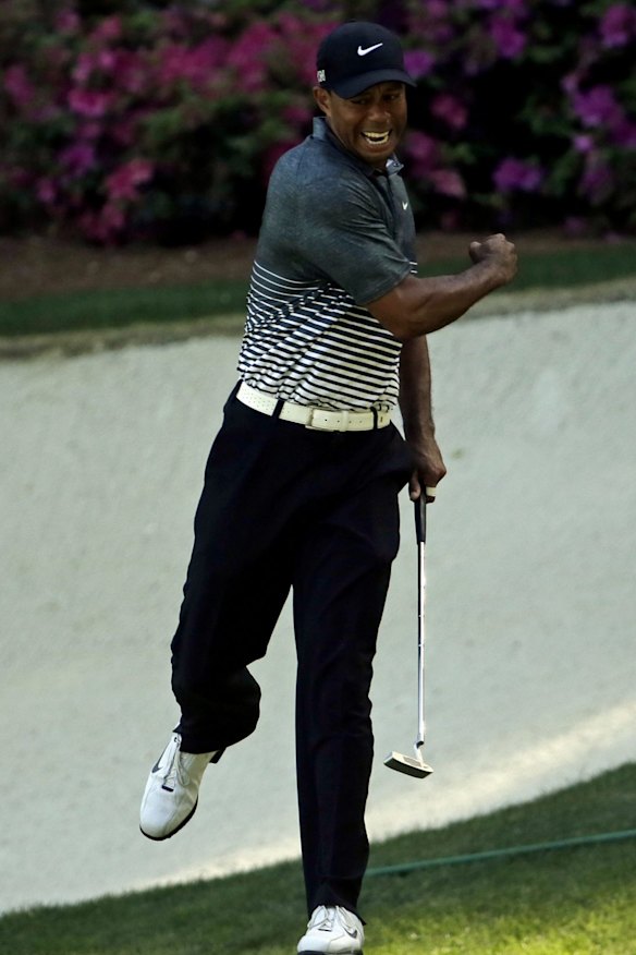 Tiger Woods reacts after his eye-catching birdie on the 13th.