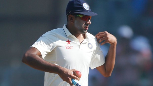 Man of the series: Ravi Ashwin carries stump and ball as he leaves the ground after India's win over England.