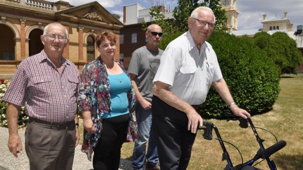 James Hughes' father Colin (right), brother Peter (second right), James's partner, Melissa Pearce and her father, Ron leave Goulburn courthouse on Wednesday, following the inquest's first session.