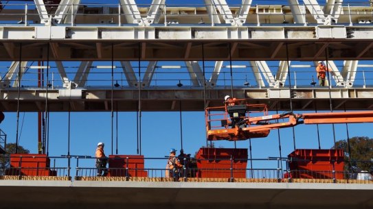 A Skytrain span being assembled by one of two massive movable gantries.