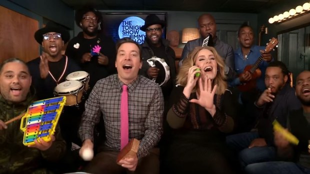 Adele jamming on her toy phone on Fallon's <i>Tonight Show</i>.