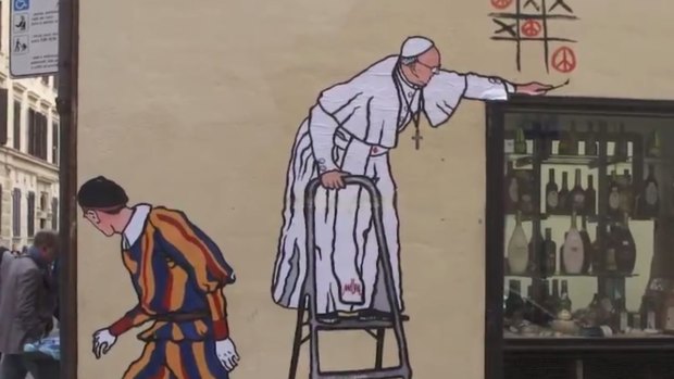 The offending Pope-as-graffiiti-artist mural was promptly removed.