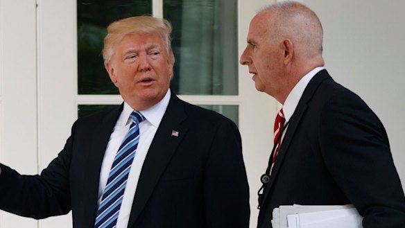 Donald Trump walks with protection officer Keith Schiller to the Oval Office.