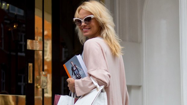 Pamela Anderson delivers lunch to Julian Assange at Embassy of Ecuador late last year.