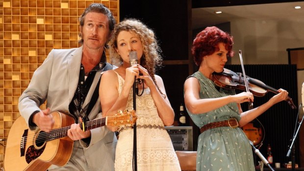 Tim Rogers, Sophie Ross (singing) and musician Xani Kolac in What Rhymes with Cars and Girls.