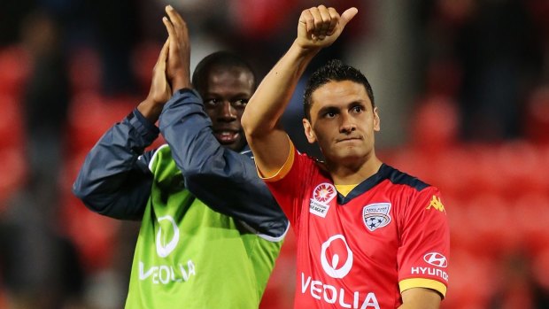Good night's work: Bruce Djite and Marcelo Carrusca of Adelaide United wave to the crowd after their win.