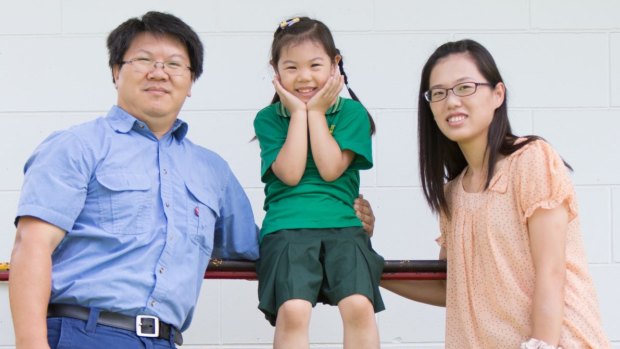 Olivia Chen with her parents Wayne Chen and Sophie Yu outside her new school.