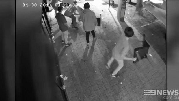 CCTV footage shows chairs being thrown.