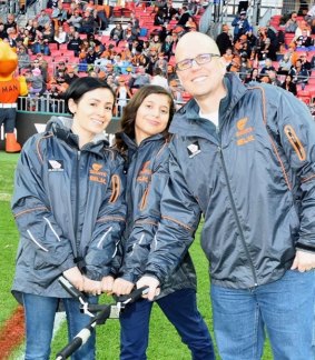 US-born Melburnians David Lampert, wife Nancy Lampert, and daughter Sofia, 13, helped raise the banner in a game against Carlton at Sydney's Spotless Stadium in 2016.