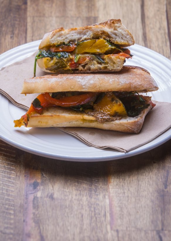 Vegan-friendly ortolano panini with roasted pumpkin, capsicum, grilled zucchini and salsa verde.