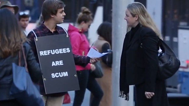 The 'Refugees are scum' sign was not well received by the public in Sydney's central business district.