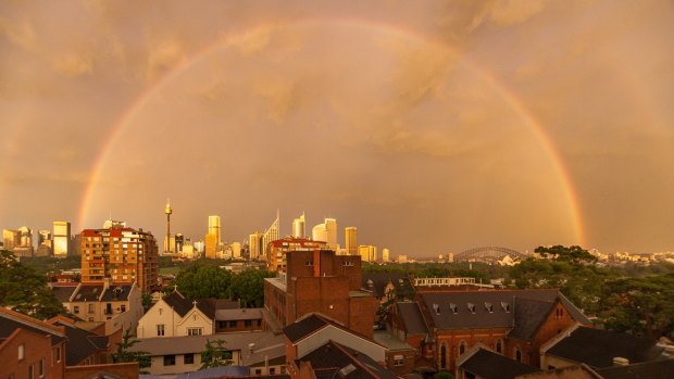 A full rainbow encircled the city, as seen from Potts Point.