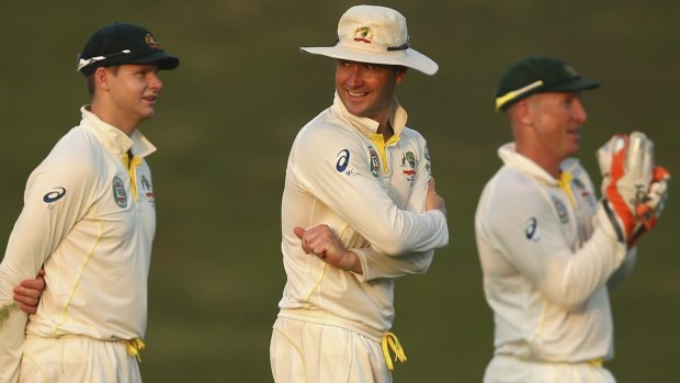 Long day: Michael Clarke, centre, used eight bowlers and unorthodox field placings in a bid to get a wicket.