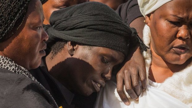 Akon Guode at the funeral for her three children in 2015.