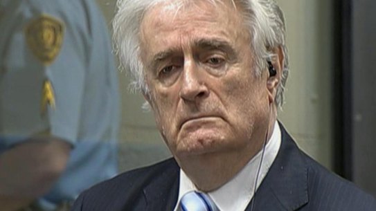 Radovan Karadzic listens as he is convicted of genocide in The Hague. 