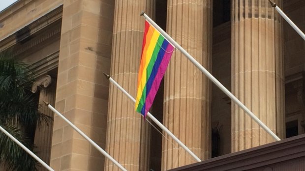 The rainbow flag flies from Brisbane's City Hall.