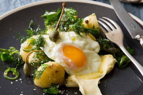 Vinaigrette potatoes with cornichons, caperberries, dill, creme fraiche and fried egg.