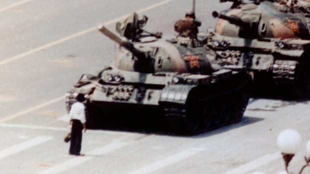 An anti-government protester stands in front of artillery tanks in Beijing's Tiananmen Square in 1989. The spirit of protest has died in Chinese students.