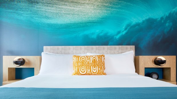 An underwater image by internationally-acclaimed surf photographer Zak Noyle appears behind every bed.