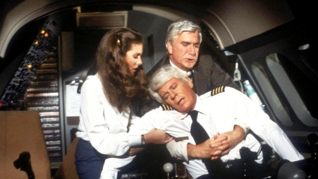Passengers were lucky Dr. Rumack (Leslie Nielsen, rear) was on board in 1980 comedy film Flying High.