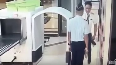 A video captured a Citilink pilot staggering through security at Surabaya airport.