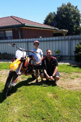 Canberra Motorcycle Centre's Brendon Bassett helps grant Nicholas Antone's wish of owning his dream motorbike.