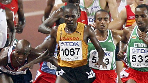 Britian's Mohammed Farah (2ndL) trips infront of USA's Bernard Lagat (L) as Uganda's Moses Ndiema Kipsiro, Ethiopia's Tariku Bekele (R) compete during the men's 5000m final, 02 September 2007, at the 11th IAAF World Athletics Championships, in Osaka. USA's Bernard Lagat won ahead of Kenya's Eliud Kipchoge and Uganda's Moses Ndiema Kipsiro.  AFP PHOTO / KAZUHIRO NOGI