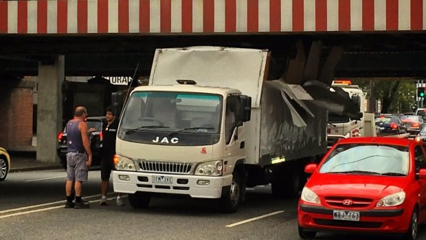 A truck that slammed into the Montague Street Bridge.