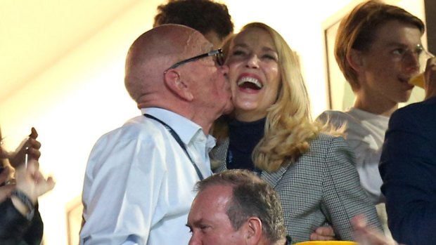 Rupert Murdoch and Jerry Hall celebrate in the stands during the Rugby World Cup final at Twickenham, London.