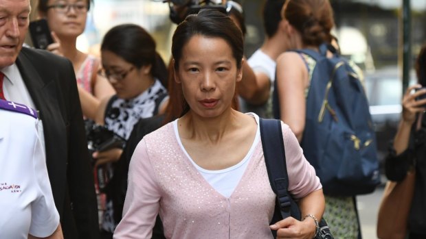Robert Xie's wife Kathy Lin outside court on Friday.