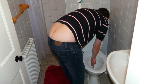Luke Rafter unblocking his friend's toilet. 