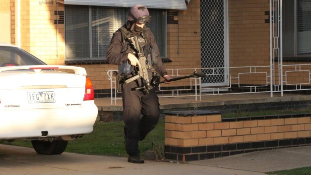 A member of Victoria Police's special operations group at the scene in Wangaratta.