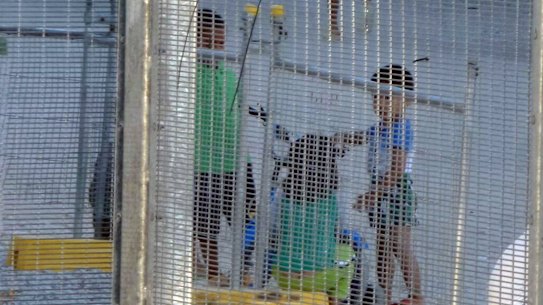 Children playing near the Refugee Processing Centre on Nauru.