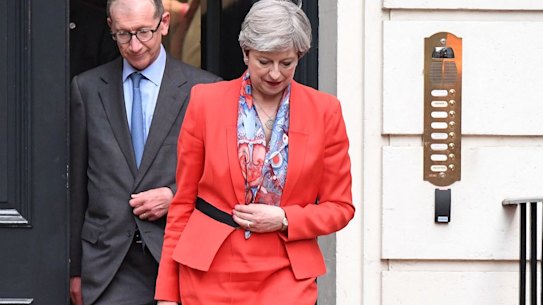 Theresa May leaves Conservative Party Headquarters with her husband Philip on Thursday.