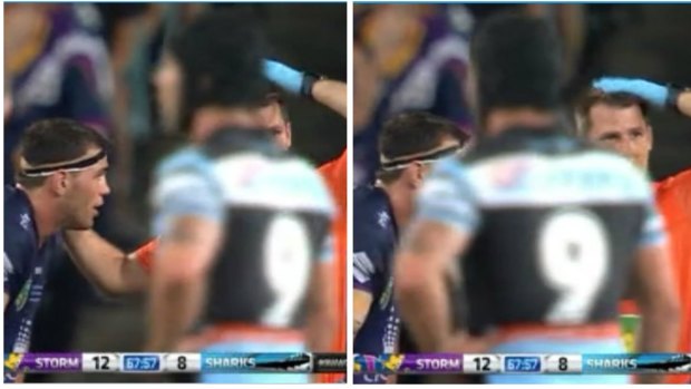 Head trouble: a Melbourne Storm trainer indicates that Storm player Dale Finucane needs a head injury assesement during the grand final against Cronulla.