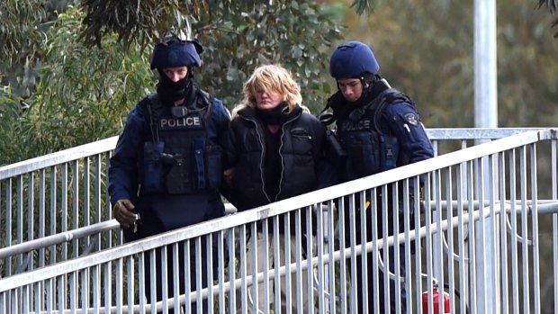A woman has been arrested after a protest on a bridge over the Monash Freeway on Tuesday.