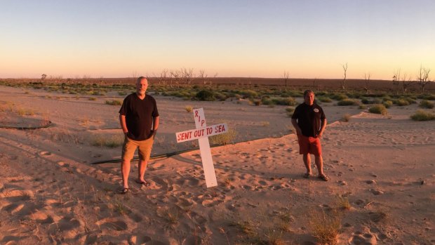 Darryn Clifton (left) and Ross Leddra on the shore of Lake Menindee, now the site of bores to supply Broken Hill with its water.