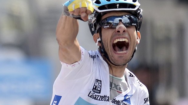 Astana rider Fabio Aru of Italy celebrates as he wins stage 19.