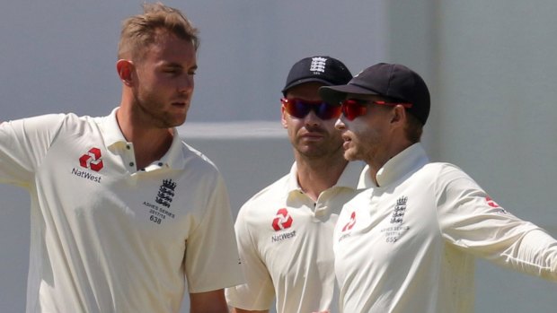 Ageing stars: Joe Root discusses tactics with the ineffective Stuart Broad and James Anderson in Perth.