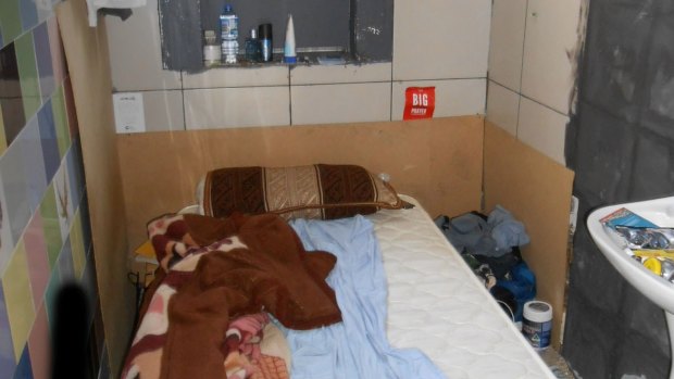 A bed in a bathroom of an illegal accommodation in the Sydney CBD.
