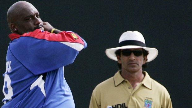 Banned: Umpire Asad Rauf (right) has been handed a five-year suspension.