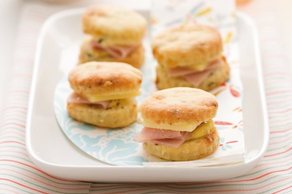 Mini scones sandwiched with ham and cheese.