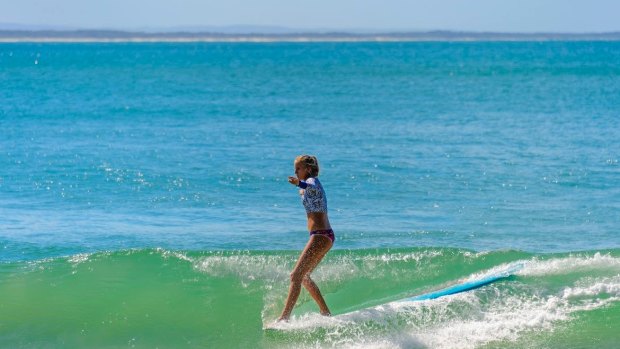 Take a surfing lesson at the main beach. 