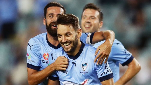 On fire: Milos Ninkovic is congratulated by Alex Brosque after scoring against Wellington.